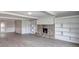 Inviting living room showcasing a stone fireplace and built-in shelving, perfect for cozy evenings at 1002 Payton Ave, Indianapolis, IN 46219