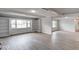 Open living area with modern flooring, built-in bookshelves, and large windows offering ample light at 1002 Payton Ave, Indianapolis, IN 46219