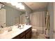 Bathroom featuring double sinks, a toilet, and a bathtub/shower at 1169 Richmond Ln, Greenwood, IN 46143