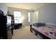 Neutral colored bedroom, a wooden bed frame, side tables and two large windows at 1169 Richmond Ln, Greenwood, IN 46143