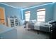 Bedroom with carpet, two windows, white furnishings, and a bed with striped bedding at 1169 Richmond Ln, Greenwood, IN 46143