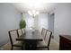 Formal dining room with seating for eight, complemented by natural light and neutral decor at 1169 Richmond Ln, Greenwood, IN 46143