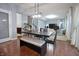 Inviting dining area featuring a modern table with bench seating, perfect for casual meals and gatherings at 1169 Richmond Ln, Greenwood, IN 46143