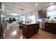 Open concept kitchen with stainless steel appliances, granite countertops, and seamless flow into the dining area at 1169 Richmond Ln, Greenwood, IN 46143