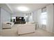 Inviting living room featuring neutral tones, large windows, and ample seating for comfortable living at 1169 Richmond Ln, Greenwood, IN 46143