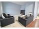 Stylish living room featuring modern seating, a large television, and contemporary decor for comfortable living at 1169 Richmond Ln, Greenwood, IN 46143