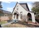 Well-kept home exterior with unique architectural details, landscaping, and a covered side porch at 1308 Conner St, Noblesville, IN 46060