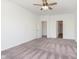 An empty bedroom is carpeted and has two doors, one of which leads to a closet at 1438 Willow Tree Ln, Sheridan, IN 46069
