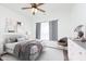 Well-lit bedroom with a neutral decor and ceiling fan with modern decor at 1438 Willow Tree Ln, Sheridan, IN 46069