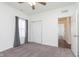 Well-lit bedroom with carpet flooring, closet with sliding doors and large window at 1438 Willow Tree Ln, Sheridan, IN 46069