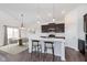 Stylish kitchen with dark cabinetry, stainless steel appliances, an island and breakfast nook at 1438 Willow Tree Ln, Sheridan, IN 46069
