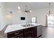 Open-concept kitchen featuring an island, stainless steel appliances, and seamless flow to the living area at 1438 Willow Tree Ln, Sheridan, IN 46069