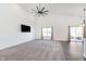 Open-concept living space features high ceilings, ample natural light, and vinyl plank flooring at 1438 Willow Tree Ln, Sheridan, IN 46069