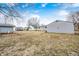 The backyard includes a detached garage and back view of the house at 1523 S Goodlet Ave, Indianapolis, IN 46241