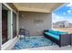 Covered back porch with outdoor seating and view of the backyard and neighborhood at 17330 Graley Pl, Westfield, IN 46074