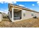 Exterior view of back porch with outdoor seating, ceiling fan and string lights at 17330 Graley Pl, Westfield, IN 46074
