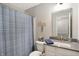 Neutral colored bathroom featuring a shower and vanity with sink and large mirror at 17330 Graley Pl, Westfield, IN 46074