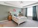 Comfortable bedroom with tray ceiling, carpet flooring, neutral paint and decorative touches; creating a serene atmosphere at 17330 Graley Pl, Westfield, IN 46074