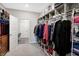 Organized walk-in closet with ample storage, hanging rods and shelving, providing efficient space for clothing at 17330 Graley Pl, Westfield, IN 46074