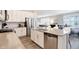 Beautiful kitchen offers stainless appliances, white cabinets, and a seamless flow to the dining area at 17330 Graley Pl, Westfield, IN 46074