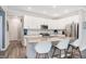 Bright and airy kitchen featuring a large island with seating and modern stainless steel appliances at 17330 Graley Pl, Westfield, IN 46074