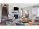 Cozy living room with fireplace, television and stairs leading to second floor at 17330 Graley Pl, Westfield, IN 46074
