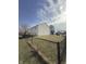 Spacious backyard with a chainlink fence, mature trees, and ample room for activities at 1881 Harvest Meadow Dr, Greenwood, IN 46143