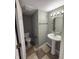 Cozy half-bath with neutral walls, stylish vanity, checkerboard floors, and modern fixtures at 1881 Harvest Meadow Dr, Greenwood, IN 46143