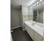Well-lit bathroom featuring a vanity with a sink and a mirror with bulb lighting at 1881 Harvest Meadow Dr, Greenwood, IN 46143