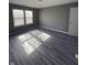 Bedroom features gray wood-look flooring and natural light at 1881 Harvest Meadow Dr, Greenwood, IN 46143