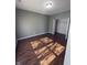 This bedroom features hardwood floors, neutral walls, and a closet for plenty of storage space at 1881 Harvest Meadow Dr, Greenwood, IN 46143