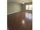 Spacious bedroom with hardwood floors, neutral walls, ample natural light, and a ceiling fan at 1881 Harvest Meadow Dr, Greenwood, IN 46143