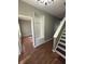 Welcoming entryway with hardwood floors, coat rack, and staircase leading to the upper level at 1881 Harvest Meadow Dr, Greenwood, IN 46143