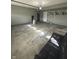 Spacious garage featuring overhead storage and an abundance of flexible space at 1881 Harvest Meadow Dr, Greenwood, IN 46143