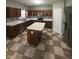 Traditional kitchen features wood cabinetry, stainless steel appliances and a checkered tile floor at 1881 Harvest Meadow Dr, Greenwood, IN 46143