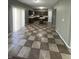 Spacious kitchen featuring checkerboard floors, a center island, and an abundance of wood cabinets at 1881 Harvest Meadow Dr, Greenwood, IN 46143