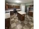 Traditional kitchen features wood cabinetry, stainless steel appliances and a checkered tile floor at 1881 Harvest Meadow Dr, Greenwood, IN 46143