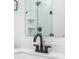 Close up of a bathroom vanity featuring matte black hardware and a white countertop with a dark faucet at 2149 N College Ave, Indianapolis, IN 46202