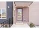 Modern home featuring a stylish front door with glass panel and address numbers at 2149 N College Ave, Indianapolis, IN 46202
