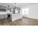 Modern kitchen with stainless steel appliances, white countertop island, and gray cabinetry at 2149 N College Ave, Indianapolis, IN 46202