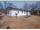 This home has a large fenced backyard with the house exterior in view, providing a private outdoor space at 2219 W 59Th St, Indianapolis, IN 46228