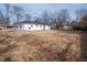 Large fenced backyard with the house exterior in view, providing a private outdoor space at 2219 W 59Th St, Indianapolis, IN 46228