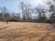 Large fenced backyard with mature trees, providing a private outdoor space for relaxation and recreation at 2219 W 59Th St, Indianapolis, IN 46228