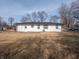 An inviting backyard shows the home's exterior, lawn, and potential for outdoor living at 2219 W 59Th St, Indianapolis, IN 46228