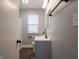 Bathroom with vanity, mirror, modern faucet and toilet at 2219 W 59Th St, Indianapolis, IN 46228