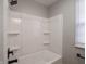 Clean and simple bathroom with a white tub and shower combo at 2219 W 59Th St, Indianapolis, IN 46228