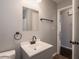 Bathroom with modern vanity, mirror, and matte black fixtures at 2219 W 59Th St, Indianapolis, IN 46228