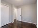 This bedroom offers hardwood floors, neutral walls, and a closet for ample storage at 2219 W 59Th St, Indianapolis, IN 46228