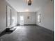 This garage offers painted floors, a utility door, and electrical outlets at 2219 W 59Th St, Indianapolis, IN 46228
