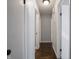 Hallway with hardwood flooring and neutral wall color at 2219 W 59Th St, Indianapolis, IN 46228